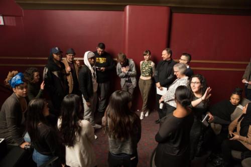 Pre-slam huddle with competing poets and judges